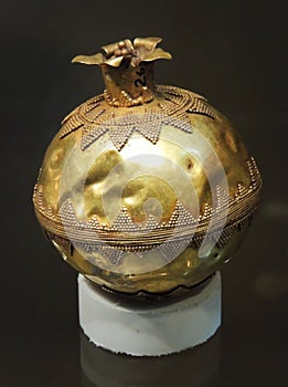 Golden promegranate ancient archaeological piece