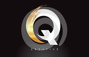 Golden Q Letter Logo with Brush Stroke Artistic Look on Black Background Vector