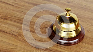 Golden Reception bell isolated on wooden background, hotel bell