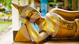 Golden reclining buddha image