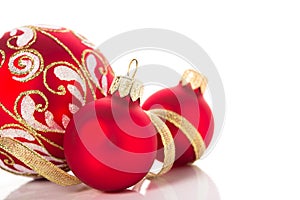 Golden and red christmas ornaments on white background. Merry christmas card.