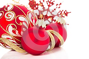 Golden and red christmas ornaments on white background. Merry christmas card.