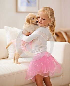 Golden retriever, hug and child happy together with love, care and development. Cute girl kid and animal puppy or pet in