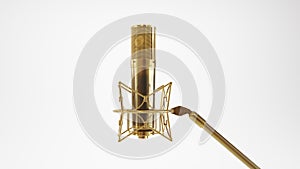 golden Retro microphone. Professional studio microphone isolated on white background.