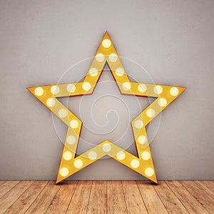 Golden retro star on concrete background and wooden floor