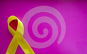 Golden ribbon and medicine. concept - a symbol of childhood cancer, pediatric oncology