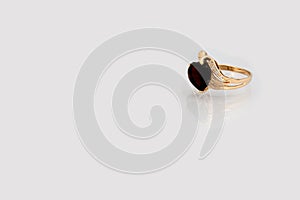 Golden ring with dark red stone