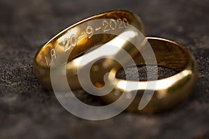 Golden ring with engraved dates photo