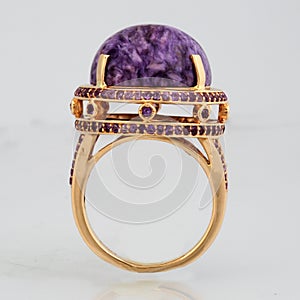 Golden ring with pink stone from back side