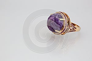 Golden ring with pink stone panorama