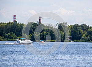 The Golden ring of Russia. Sunny summer day in Yaroslavl. Bank of the Kotorosl river. Boats on the river