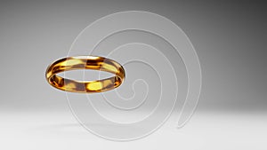 Golden Ring Spinning on Studio Gray Background