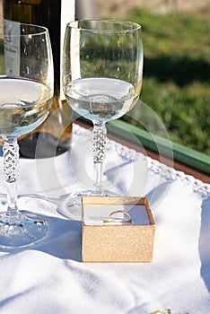 Golden ring and wineglasses as proposal aesthetics in garden