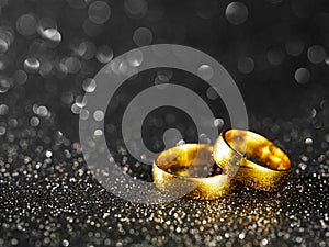 golden rings on black background