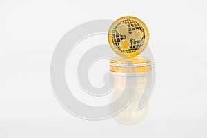 Golden Ripple coin with reflection on the table, online digital currency. Concept of block chain, market uprise