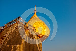 Golden rock or Kyaiktiyo pagoda with blue sky background, Myanmar