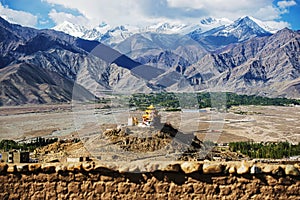 Golden roof monastery and snow mountain range Leh Ladakh ,India