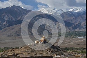 Golden roof monastery and snow mountain range Leh Ladakh ,India