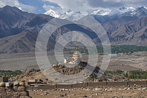 Golden roof monastery and snow mountain range Leh Ladakh ,India