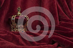 Royal crown on a red velvet background photo