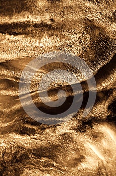 Golden sand abstract resin art swirl luxury background. Liquid