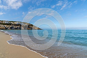 golden sand beach and clear turquoise waters at Cala Mesquida beach in eastern Majorca