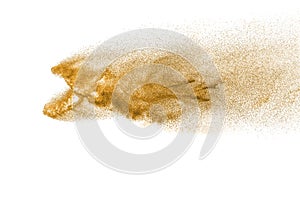 Golden sand explosion isolated on white background.