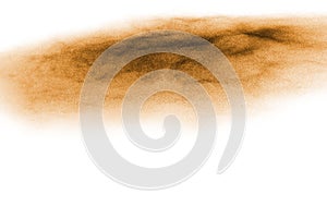 Golden sand explosion isolated on white background. Abstract sand cloud.Sandy fly wave in the air