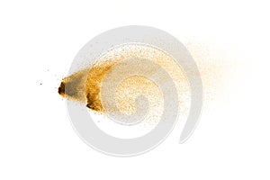 Golden sand explosion isolated on white background. Abstract sand splashing