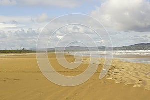 The golden sands of the deserted beach at Benone in County Londonderry on the North Coast of Ireland