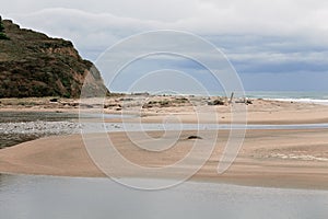 Golden Sandy Beach and Lagoon With Waves Rolling in, with Birds and 2 People at San Gregorio Reserve, Half Moon Bay, California