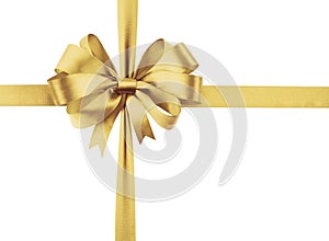 Golden sateen ribbon with bow as a gift symbol on white background photo