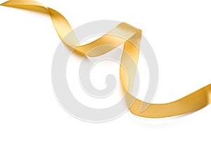 Golden satin ribbon isolated on white background