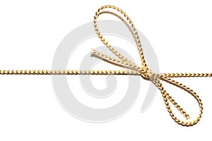 Golden satin rope parallel to frame with knotted bow gift ribbon wrap for Christmas present. Vector illustration.