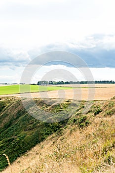 Golden scottish wheat fields and ravines in Dunnottar. Panoramic