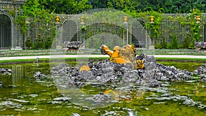 Golden sculpture in the fountain of Versailles â€“ Bassin de l Encelade