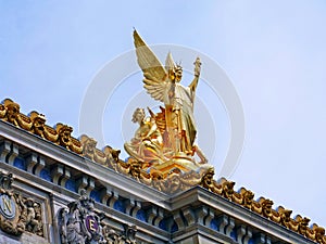 Golden Sculpture looking sky in paris