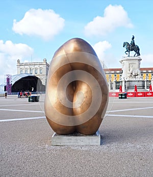 Golden Sculpture by Tony Cragg named Integers at Praca do Comercio in Lisbon Portugal