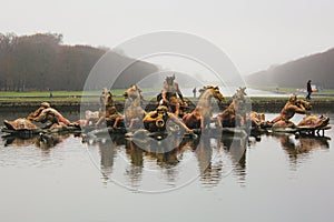 Golden sculptures in a pond in a garden