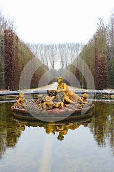 Golden sculptures in a pond in a garden