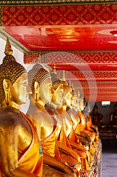 Golden sculptures of sitting buddhist monks