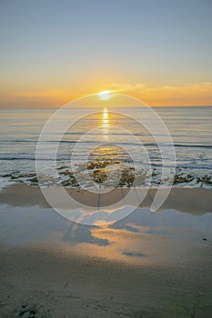 Golden setting sun at the beach in Del Mar Southern California at sunset