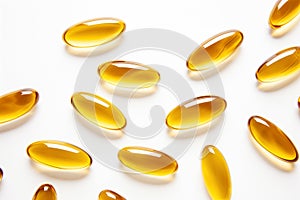 Golden shine Omega-3 capsules on white. Medicine healthy supplement for healthy diet fish oil. White background close up photo