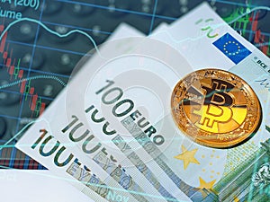 Golden shiny bitcoin and euro banknotes on computer keyboard