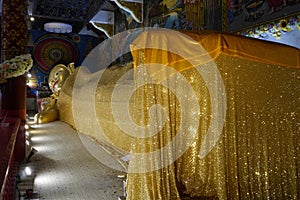 A Golden shrouded reclining Buddha.