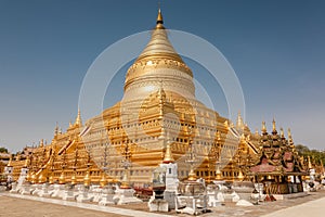 Golden Shwesandaw stupa under a blue sky