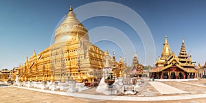 Golden Shwesandaw stupa under a blue sky