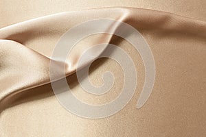 Golden silk fabric background, smooth and floating texture for design background