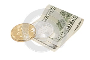 Golden and Silver bitcoin coins and one hundred dollar banknote