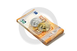 Golden and silver bitcoin over Euro money. Bitcoin cryptocurrency. Crypto currency concept. Bitcoin with euro bills. Bitcoins stac